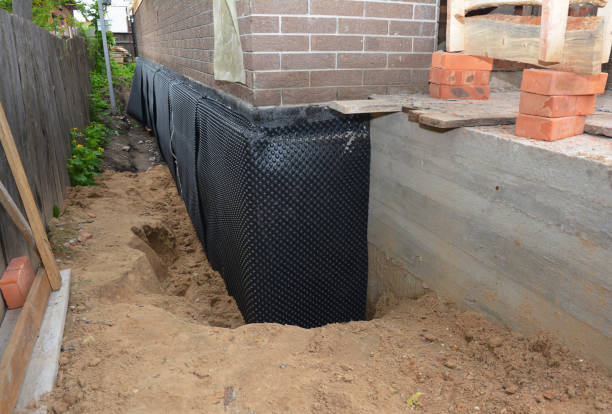 Happy homeowners after waterproofing job in Hibernia